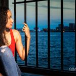 portrait-photography-model-looking-away-into-ocean-iris-tavarez