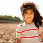 children-photography-boy-at-beach-staring-at-camera